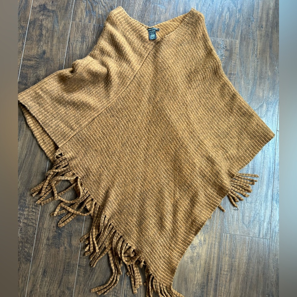 One size fits all pullover fringe sweater. Never worn